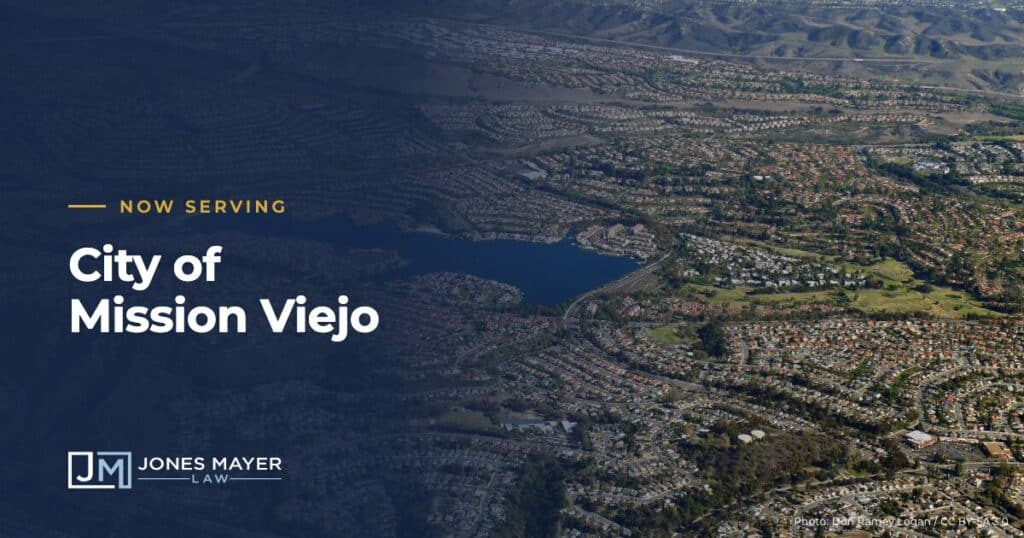 Aerial view of Mission Viejo and Lake Mission Viejo with the text Now Serving City of Mission Viejo and the Jones Mayer logo
